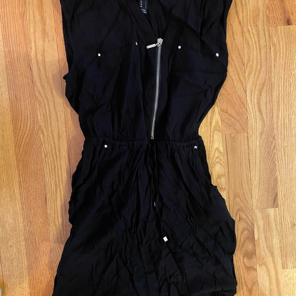 Black thigh length sleeveless dress